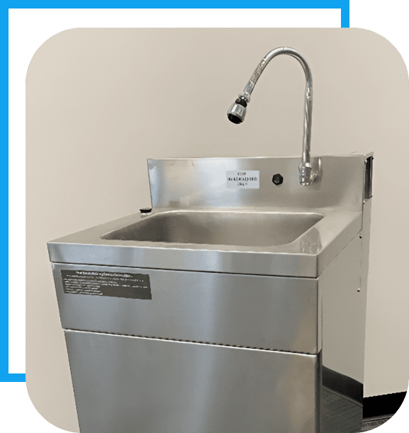 A stainless steel sink with a faucet on top of it.